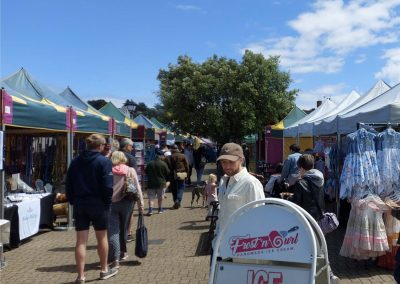 Watchet Esplanade is busy with a street fair and various stalls